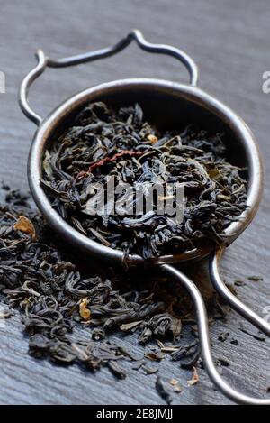 Green tea in tea strainer Stock Photo