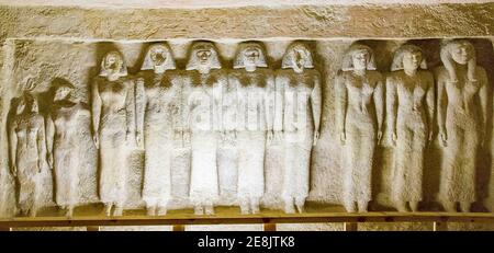Egypt, Guizeh, tomb of the Queen Meresankh III, grand-daughter of Kheops and wife of Khephren. North room, north wall, 10 rock-cut female statues. Stock Photo