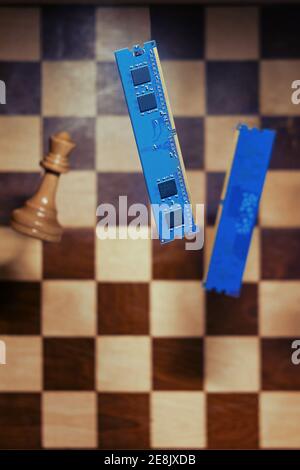 Computer memory and an old chessboard with chess pieces. Concept of technology problems, ai and science development Stock Photo