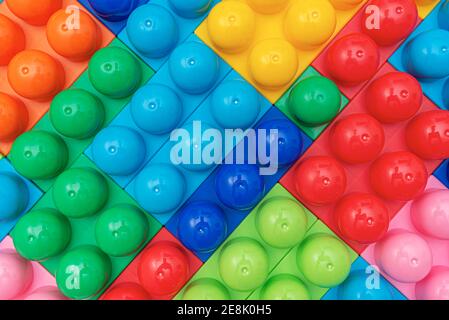 Children's multi-colored constructor as an abstract background. Multicolored blocks close-up. Stock Photo