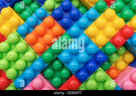 Children's multi-colored constructor as an abstract background. Multicolored blocks close-up. Stock Photo