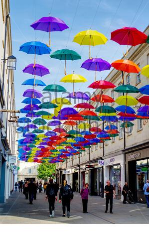 Display of multi-coloured umbrellas hanging from the ceiling of the ...