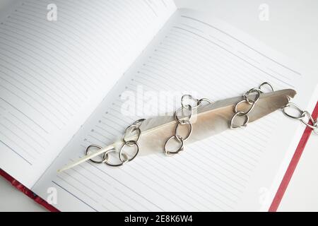 red empty book or diary in chains. information security concept. top view Stock Photo
