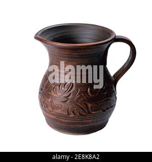 ceramic jug with handle isolated on white background. handicraft pattern on pot Stock Photo