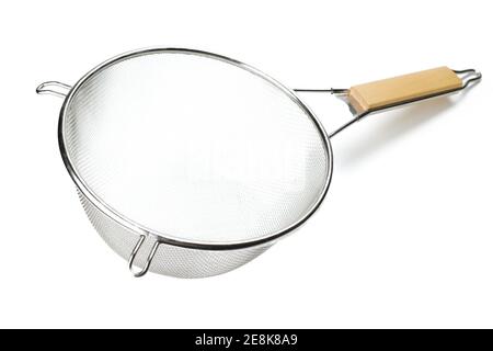 silver colored metalic colander with wooden handle isolated on a white background Stock Photo