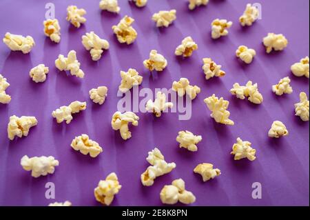 Popcorn pattern isolated on purple background Stock Photo