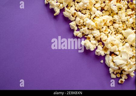 Popcorn border isolated on purple background Stock Photo