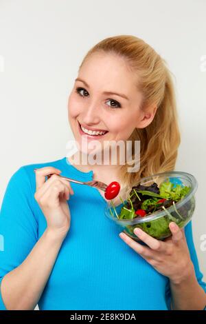 Woman holding salad Stock Photo