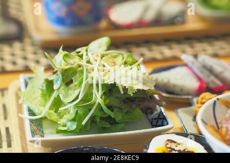 Vegetable Salad include frillice iceberg lettuce and sunflower sprout with Japanese Sesame Dressing - Breakfast set Japanese style Stock Photo