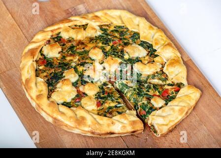 Vegetable Tart, puff pastry, chard, carrot, onion, garlic and red peppers. Stock Photo