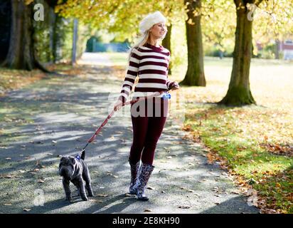 Beautiful woman walking in the park Stock Photo