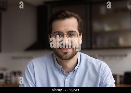 Millennial male team leader organize virtual workshop with employees online Stock Photo