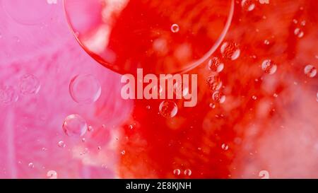 Oil drops on a water surface. Abstract and background. Stock Photo