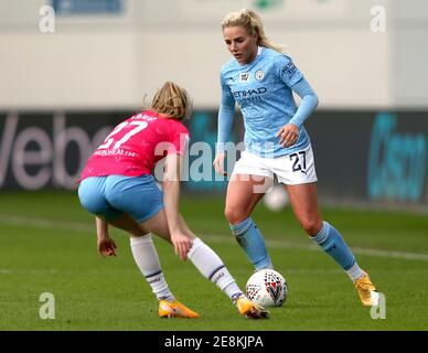 Manchester City's Alex Greenwood (right) and West Ham United's Maisy Barker battle for the ball during the FA Women's Super League match at Manchester City Academy Stadium, Manchester. Picture date: Sunday January 31, 2021. Stock Photo