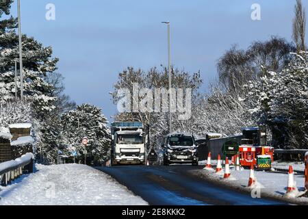 vehicles travelling after heavy snowfall Stock Photo
