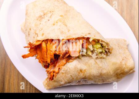 A closeup shot of traditional Mexican street food isolated on the wooden background Stock Photo