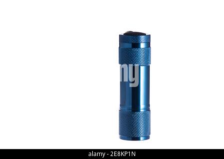 Small blue pocket flashlight on an isolated white background. Stock Photo