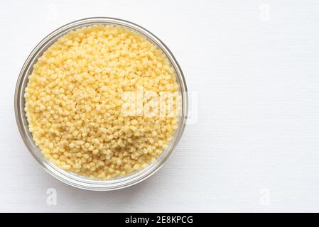 Uncooked French Couscous in a Bowl Stock Photo