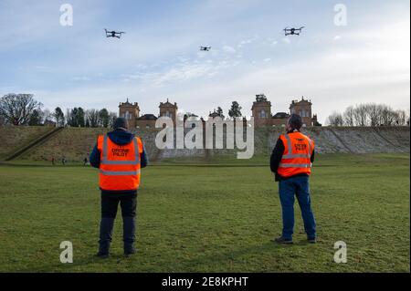 Hamilton, Scotland, UK. 31st Jan, 2021. Pictured: Professional drone pilots flying their drones seen in Chatelherault Country Park as others take in exercise as the temperature stays just above freezing. The sun is out and people are enjoying themselves during the coronavirus phase 4 lockdown. Credit: Colin Fisher/Alamy Live News Stock Photo