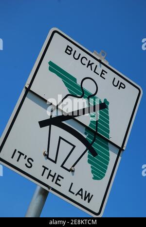 A sign in Florida reminds drivers to use their seatbelts for safety Stock Photo