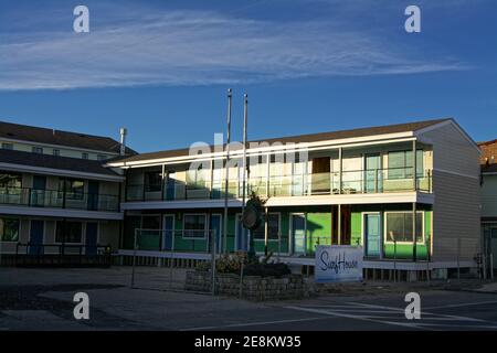 Hampton Beach - Hampton, New Hampshire – An offseason motel stands empty during remodeling as the sun sets on a winter night. Stock Photo