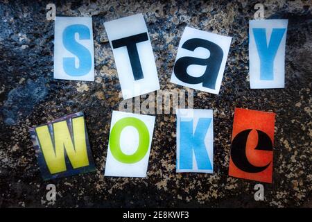 TheTerm "Stay WOKE" using cut-out paper letters in the ransom note effect typography Stock Photo