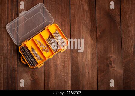 Organizer for storing nozzles for tools, building materials. Cells with drill nozzles, screwdrivers. Stock Photo