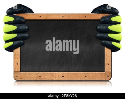 Two hands with protective black and green work gloves hold a blank blackboard with wooden frame, isolated on white background with copy space. Stock Photo