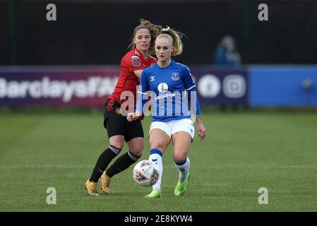 Alisha Lehmann of Everton passes the ball back while under pressure from Katie Zelem of Manchester United. Elise Hughes of EvertonBarclays Women's super league match, Everton Women v Manchester Utd Women at Walton Hall Park in Liverpool on Sunday 31st January 2021. this image may only be used for Editorial purposes. Editorial use only, license required for commercial use. No use in betting, games or a single club/league/player publications.pic by Chris Stading/Andrew Orchard sports photography/Alamy Live News Stock Photo