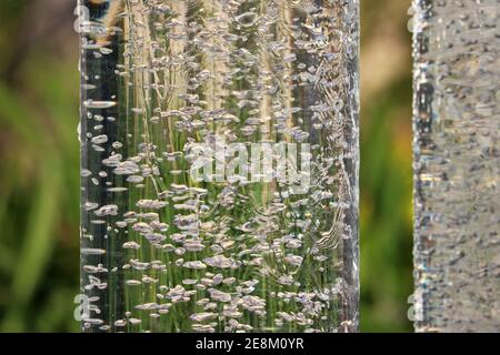 Air bubbles in a glass cylinder Stock Photo