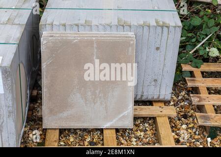 Close up of a pallet of Pressed Concrete Slabs for sale at a Builders Merchants in England, UK Stock Photo