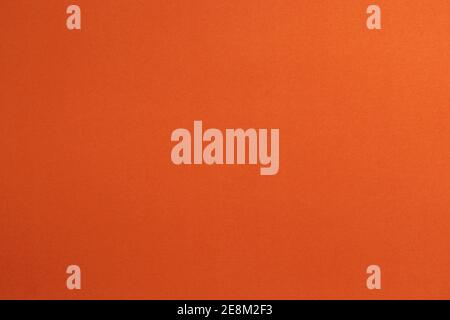 Close up Mottled orange paper background and texture. Orange paper with stripes of paper. Stock Photo