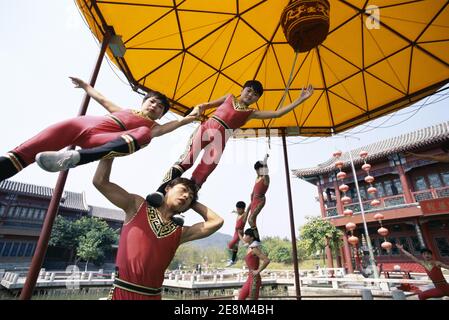 Asia,China, Shanghai, Child acrobats performing in acrobatic show Stock Photo