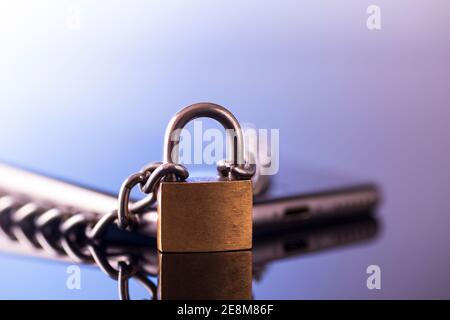 Modern smartphone with a lock. Data protection. Mobile phone security concept. Stock Photo