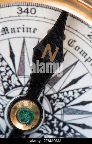 Close up shot of an old Fashioned compass pointing to north Stock Photo