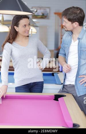 a couple is playing snooker Stock Photo
