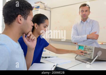 young attractive students of mechatronics working on project Stock Photo