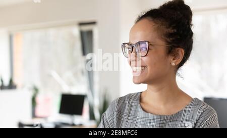 Happy African American business woman wearing trendy glasses