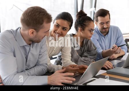 Female Indian coach helping new hired employee Stock Photo