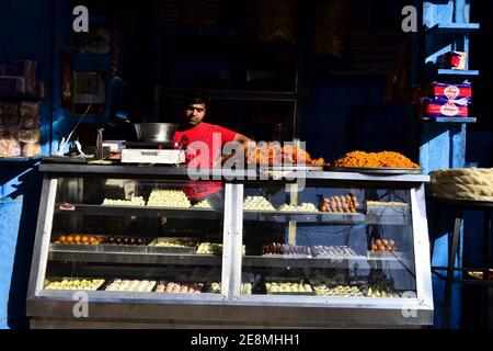 Jodhpur, Rajasthan, India - December, 2016: Man selling Indian sweets on the street. Stock Photo