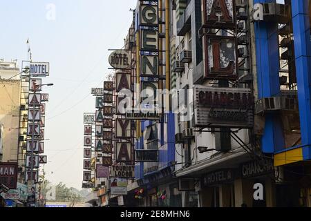 Delhi, India - November, 2016: Many hotel sign boards hanging on buildings on the street in Paharganj district (Main Bazar or Bazaar) Stock Photo