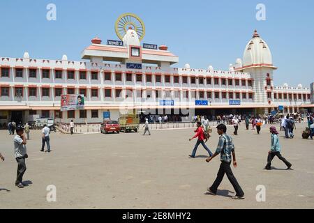 Varanasi, India - April, 2014: People walking on the square in front of Varanasi Junction building. Main railway station in a city. Stock Photo