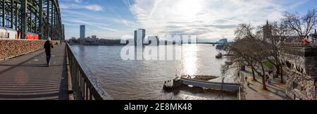 cologne, NRW, Germany, 01 31 2021, panorama of Hohenzollernbridge, rhine river and shore of old town Stock Photo