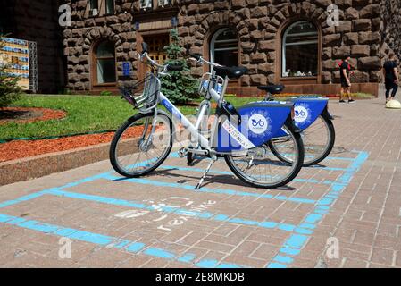 KYIV, UKRAINE - MAY 26: The Nextbike parking place with bicycles is near Kyiv City State Administration on May 26, 2019 in Kyiv, Ukraine. It is locate Stock Photo