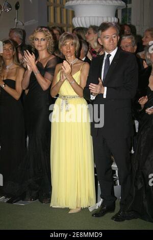 Charlize Theron and Bernard Arnault attends the Dior Womenswear