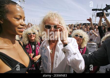 French singer Michel Polnareff waves to the crowd next to his girlfriend Daniella and fans during the celebration of his 63th birthday in Marseille, France on July 3, 2007. Photo by Pascal Parrot/ABACAPRESS.COM Stock Photo