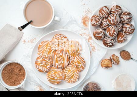 Lemon cookies and small eclair cakes on a white background. Top view, horizontal. Stock Photo