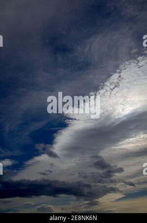 Sky with different types of clouds including a band of so called mackerel sky, indicator of a weather change Stock Photo