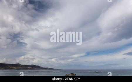 Sky with different types of clouds including a band of so called mackerel sky, indicator of a weather change Stock Photo