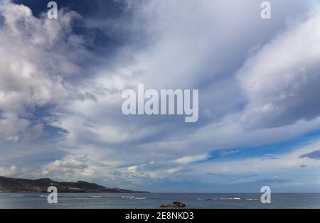 Sky with different types of clouds including a band of so called mackerel sky, indicator of a weather change Stock Photo